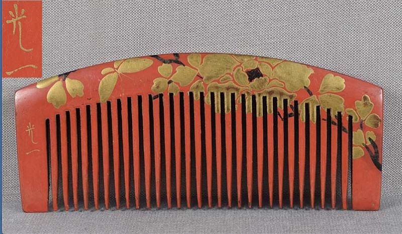 19c Japanese lacquer buffalo horn KUSHI hair comb by KOICHI: Late Meiji period (1890s 1912) Japanese buffalo horn kushi (hair comb) with lacquer decoration of a butterfly by a blooming peony, design continuing on both sides. Signed KOICHI on the front. Very