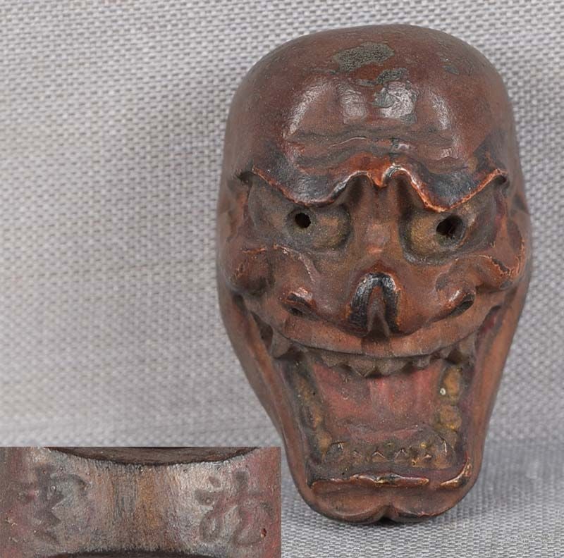 19c netsuke MASK SHIKAMI by RYUUN: 19th century Japanese small lacquered wood netsuke representing a theatrical mask of Shikami - a demon whose overriding purpose is to do evil to man. Crisp detailing, nicely lacquered, great patina.
