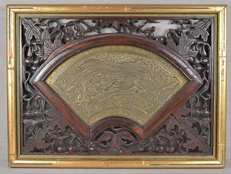 19c Chinese bronze plaque PHOENIX in flight: 19th century Chinese bronze fan shaped plaque with low relief depiction of a phoenix in flight over a latticed garden fence with pine clusters above and pomegranate bushes on rocks below. Very nice