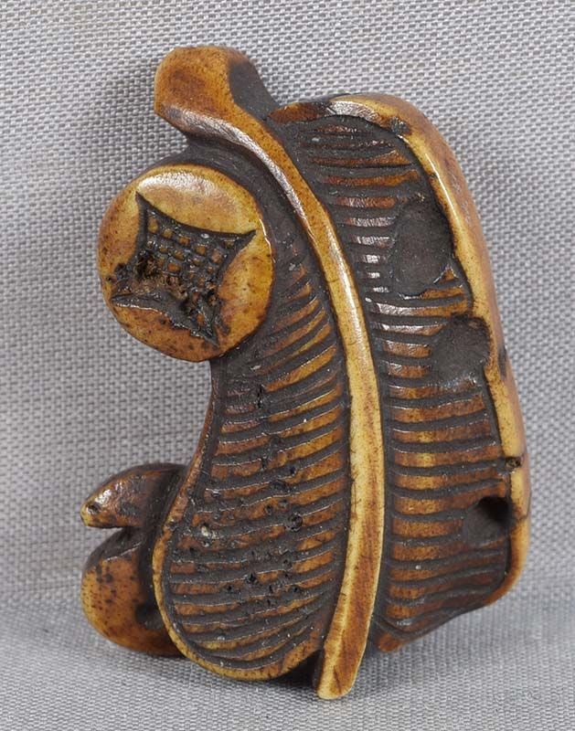 19c Asakusa netsuke AUSPICIOUS OBJECTS fan, coin, magatama: 19th century Asakusa school staghorn netsuke of three auspicious objects - a fan, a coin and a magatama. Strong piece in Japanese taste typical of Asakusa school, beautiful dark staining, warm patina,