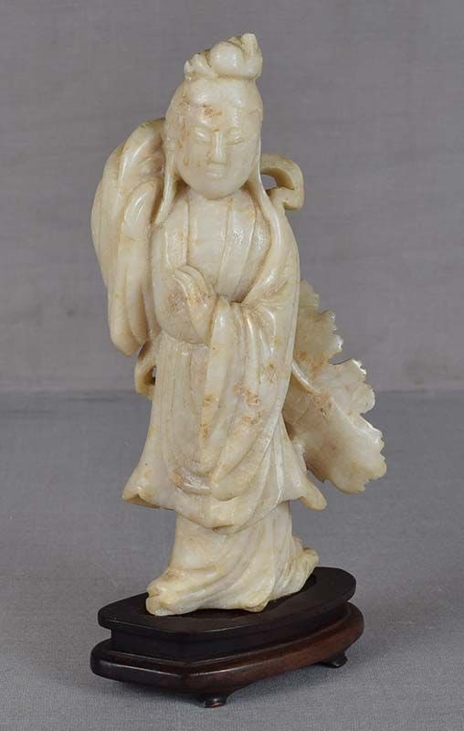 19c Chinese SOAPSTONE FIGURE GYANYIN: 19th century Chinese soapstone figure of Guanyin - the Boddhisattva of Compassion - holding a large lotus leaf on a stem behind her back. Nicely carved out of beautiful cream colored stone, wonderful