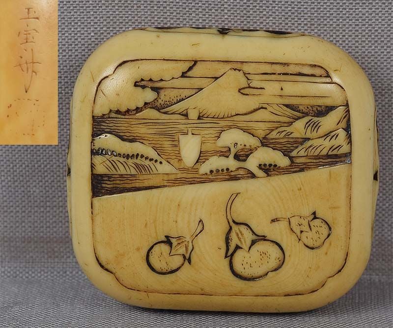 19c netsuke Mount FUJI & eggplants by GYOKUHOSAI: 19th century netsuke in manju pillow shape carved on the front with a scholarly landscape of Mount Fuji partially obscured by clouds, a wide bay with a sail boat and pines, and a lower part depicting 