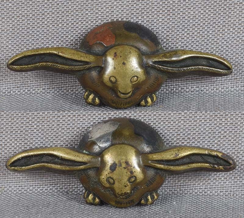 18c pair Japanese sword MENUKI RABBITS: Pair of 18th to early 19th century Japanese sword menuki each depicting a sitting spotted usagi (rabbit) with its ears spread widely to the sides. Great design with somehow funny faces. Bronze with