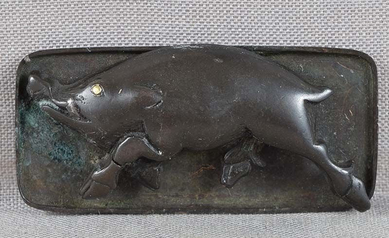 19c Japanese MAE-KANAGU pouch clasp RUNNING BOAR: 19th century Japanese bronze mae-kanagu (tobacco pouch clasp fitting) in a form of a running boar. Wonderful dynamic design, great crisp detailing, gilded eye. Comes with original backing with design