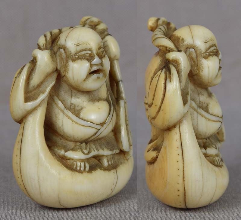 Early 19c netsuke HOTEI on bag - 2