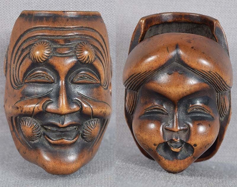Early 19c netsuke OKINA & OKAME masks: 19th century wooden netsuke carved as double theatrical masks of Okina and Okame. Nice pairing of characters, excellent quality carving, wonderful faces, great detailing, beautiful wear and rich lustr