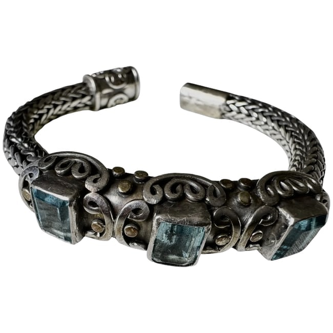Bangle Bracelet Designer 78g sterling silver w/gold dots: Heavily oxidized .925 Sterling Silver body accented with solid 18K yellow gold beaded dots nestled within the filigree scrollwork.Gemstones: Features three prominent, vibrant emerald-cut or square