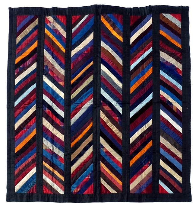A very striking bold folk art chevron quilt c.1900: This is a very striking, bold, chevron strips quilt. It has strong colors and a great design. While it certainly can be used, it would look wonderful hung and displayed. The fabrics are silks,