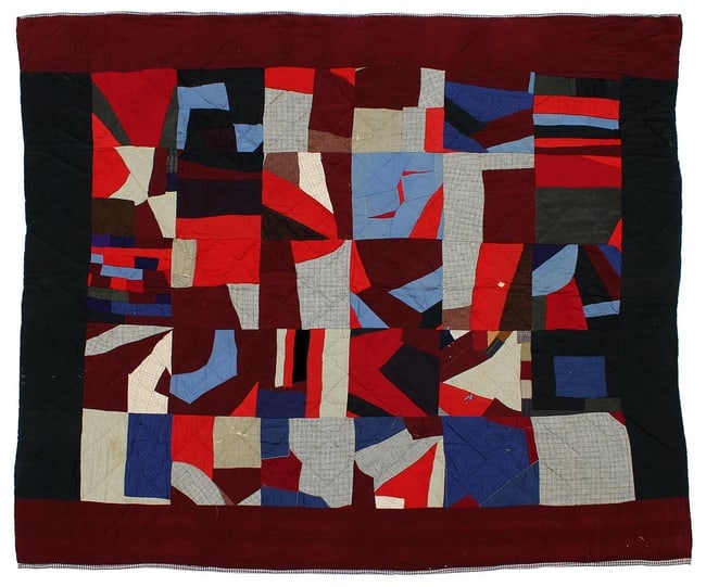 A wonderful folk art visual quilt: This is a great, folk art crazy quilt, pieced in blocks, with a burgundy and black border. The fabrics are cotton and wool, with lots of variation in texture, and some very small scraps used. The back