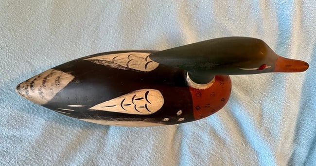 Contemporary Merganser Decoy w/Orig. Paint: A decorative Merganser Decoy w/ carved crest and glass eyes, dating from the mid to late 20th century. Original paint, 17 1/4" from beak to tail, 6 1/2" high at the head and the body is about 4 3/4"