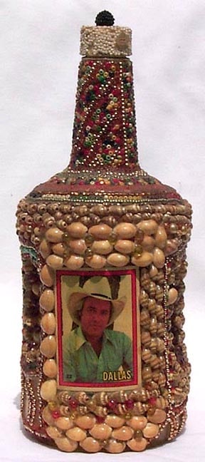 A memory bottle decorated with beads, shells, and trading card - 3