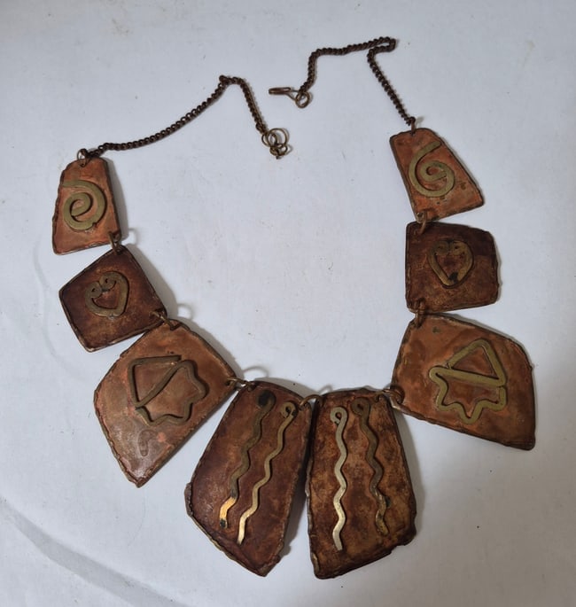 Copper and brass necklace: Necklace with copper oblong plates with brass decoration. Looks 1940s. Fits any neck. Excellent condition. Shipping: Domestic: Flat-rate of $20.00 to anywhere within the contiguous U.S.