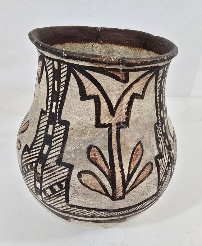 Isleta Pueblo pottery jar: Title: Isleta Pueblo pottery jar Dimension: 8.5" tall x 6.75" diameter Description: A medium sized pottery jar from Isleta Pueblo ca late 19th or early 20th century. The piece was broken and restored
