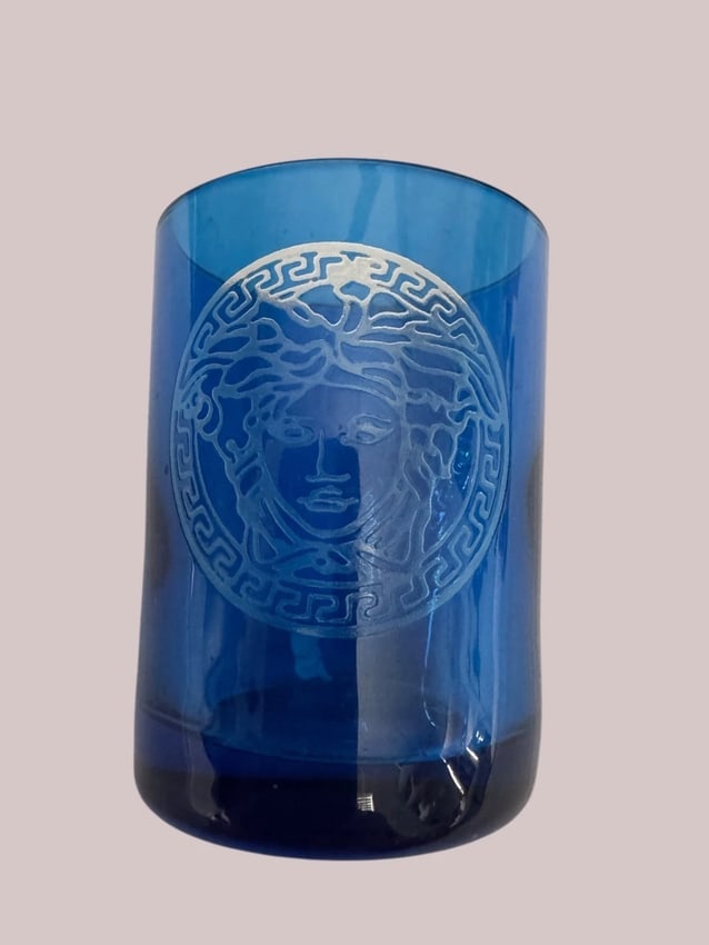 Authentic signed VERSACE MEDUSA NOTIVE TABLE LIGHT BLUE GLASS CANDLE HOLDER: This product is an authentic and signed Versace Medusa Notive Table Light in a glossy blue glass candle holder. Made in the 1990s, this decorative collectible is perfect for all occasions and adult us