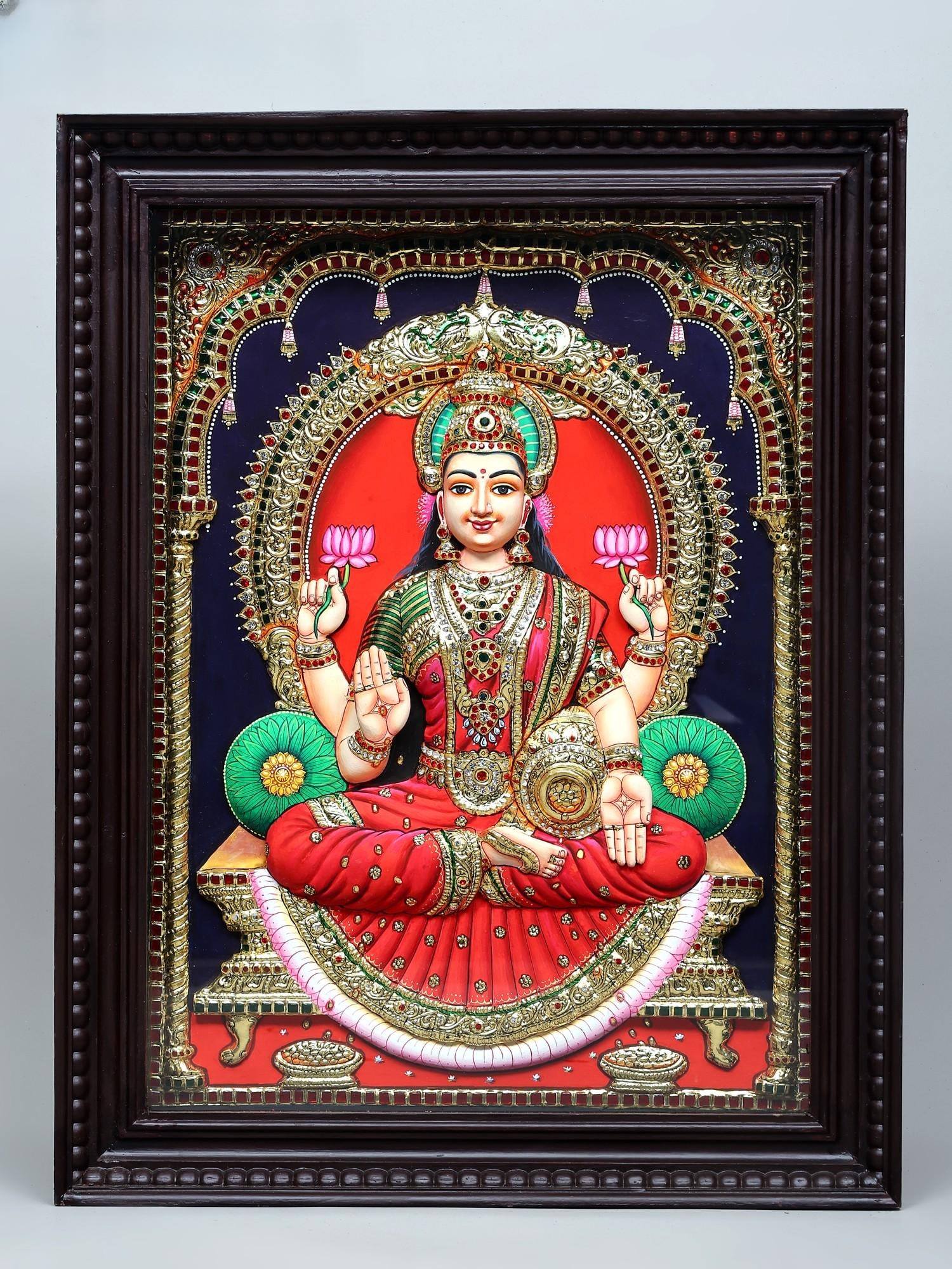 Four Armed Goddess Lakshmi Seated on Kirtimukha Throne | Traditional Colors with 24 Karat Gold |: Title: Four Armed Goddess Lakshmi Seated on Kirtimukha Throne | Traditional Colors with 24 Karat Gold | Embossed Three Dimensional Tanjore Painting Description: Tanjore (Thanjavur) Painting Reserve: $