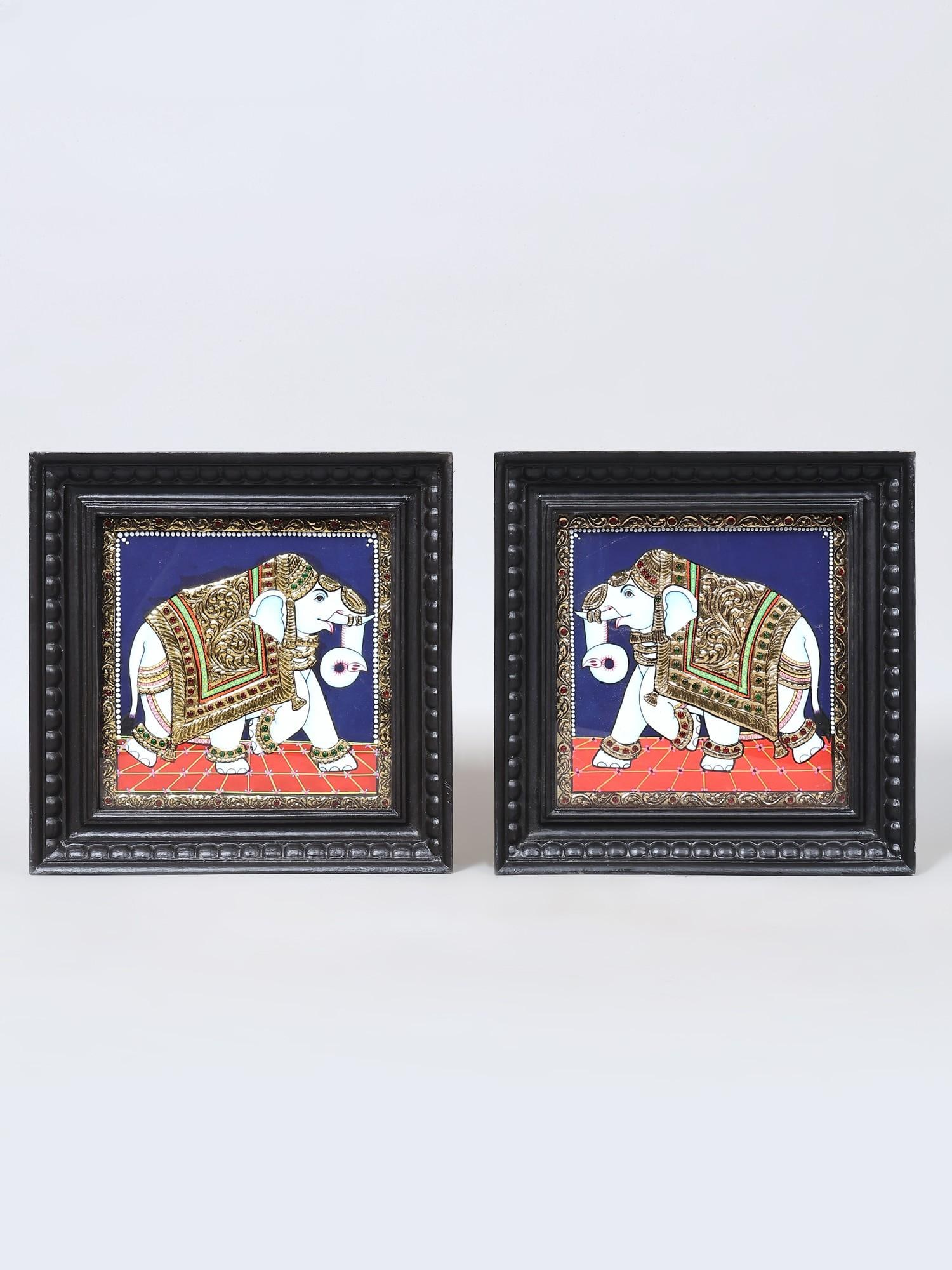 Pair of Elephants | Framed Tanjore Paintings with Gold Work: Title: Pair of Elephants | Framed Tanjore Paintings with Gold Work Description: Tanjore (Thanjavur) Painting Reserve: $365.00 Shipping: Domestic: Shipping rates are determined by