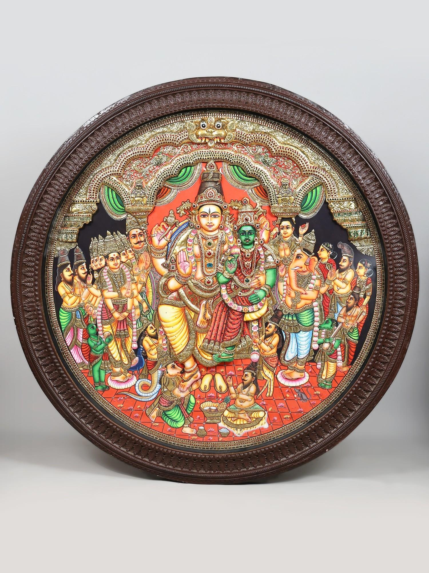 Large Shiva-Parvati Kalyanam (Divine Wedding Ceremony of Goddess Meenakshi and Lord Sundareswarar) |: Title: Large Shiva-Parvati Kalyanam (Divine Wedding Ceremony of Goddess Meenakshi and Lord Sundareswarar) | 24 Karat Gold Work | Circular Shaped Embossed Tanjore Painting Description: Tanjore