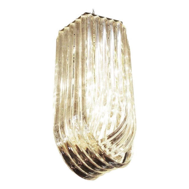 1950s Hollywood Regency Sculptural Lucite & Gold Tone Loop Ribbon Chandelier: Title: 1950s Hollywood Regency Sculptural Lucite & Gold Tone Loop Ribbon Chandelier Description: Large mid-century Hollywood Regency Modern sculptural Lucite loop chandelier is comprised of three rows
