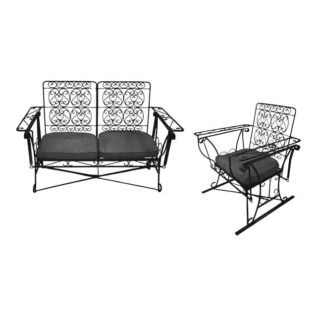 Black Scrolling Wrought Iron Glider Rocking Settee & Chair Patio Outdoor Set: Title: Black Scrolling Wrought Iron Glider Rocking Settee & Chair Patio Outdoor Set Description: A set of black 1950s Mid-Century Woodard style wrought iron wire patio/outdoor seating featuring a Glid
