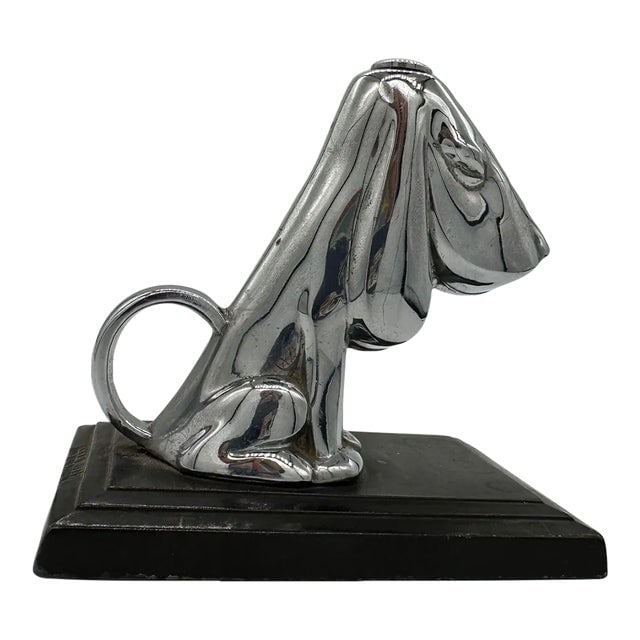 1935 Ronson Hound Dog Table Striker Lighter by Ronson: Title: 1935 Ronson Hound Dog Table Striker Lighter by Ronson Description: In 1935, a desk-mounted striker lighter was crafted. It featured a basset hound canine adorned with a layer of chromium