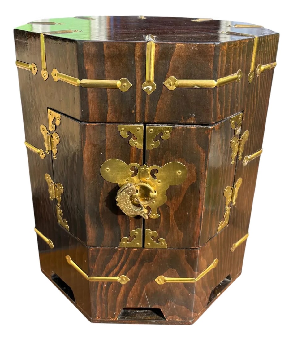Asian Two Door Side Table: Quick Hits: - Two door nightstand or end table - Far eastern style - Dark stained elmwood finish - Brass fish lock and key included More About This Item: This beautiful two door side table could be