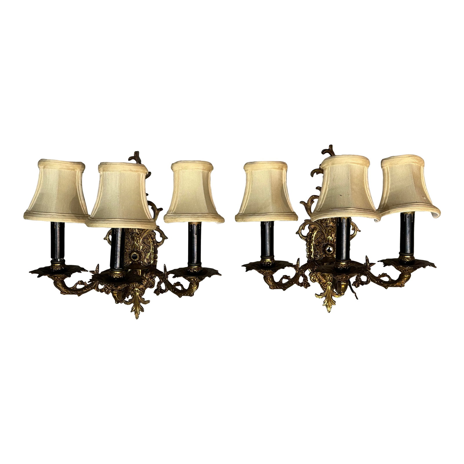 Pair of Vintage Bronze Three Arm Wall Sconces: Illuminate your home with the warm, timeless beauty of this pair of vintage bronze three-arm wall sconces. Crafted from durable bronze, these sconces feature an intricate, classic design with three