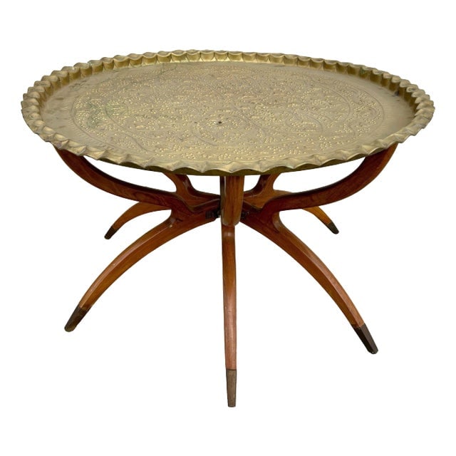 1950s Mid-Century Moroccan Moorish Tray Table: Title: 1950s Mid-Century Moroccan Moorish Tray Table Description: Original hand-hammered brass Moroccan tray with a 6-leg folding Mide-century arched mahogany base, a seamless blend of the bohemian an
