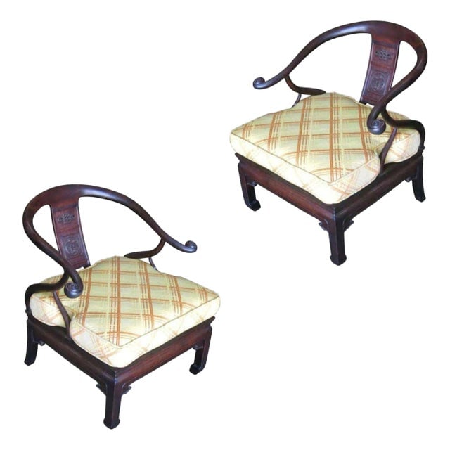 1950s James Mont Style Horseshoe Lounge Chairs- a Pair: Title: 1950s James Mont Style Horseshoe Lounge Chairs- a Pair Description: Stunning pair of James Mont-style Asian horseshoe armchairs. Both possess a dark stain wood frame with hand-carved reliefs an