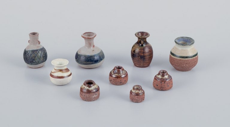 Stouby Keramik, Denmark, a collection of nine miniature ceramic vases with glaze in brown and sandy - 2