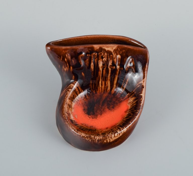 Vallauris, France, two ceramic bowls in brightly colored glazes in red and orange on a dark brown - 4