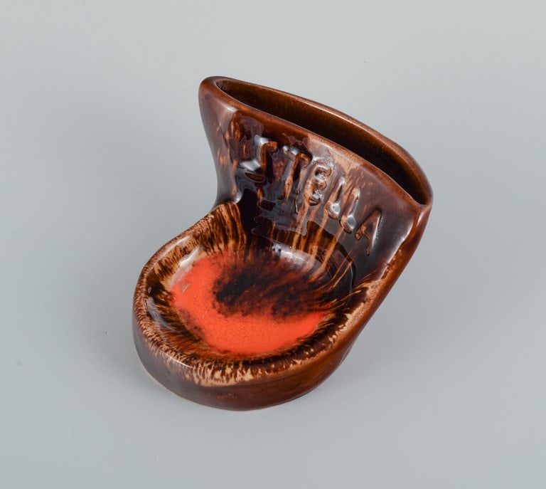 Vallauris, France, two ceramic bowls in brightly colored glazes in red and orange on a dark brown - 5