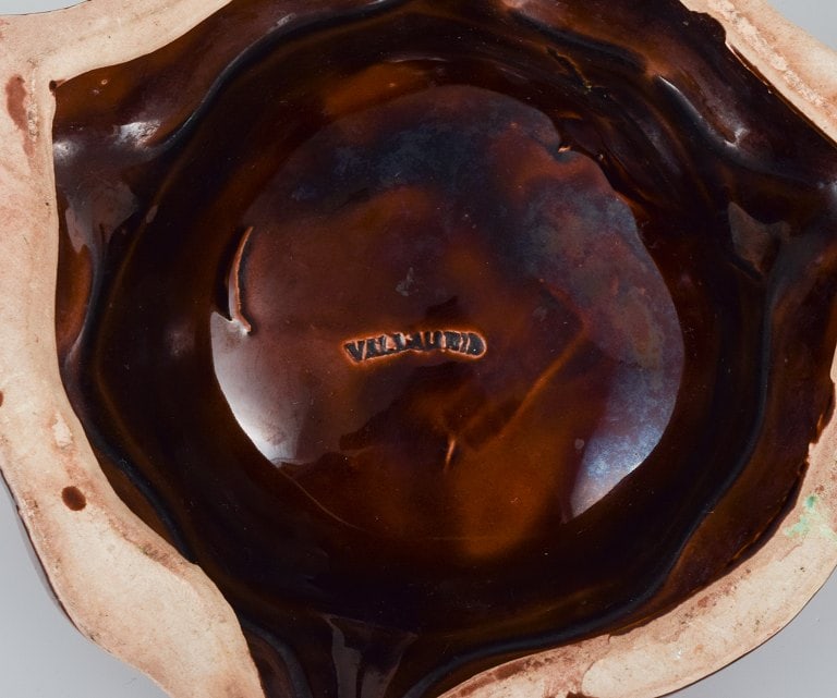 Vallauris, France, two ceramic bowls in brightly colored glazes in red and orange on a dark brown - 6
