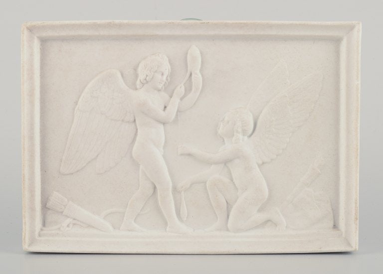 Bertel Thorvaldsen for Royal Copenhagen. Amor and Hymen spins the thread of life. Biscuit relief. - 2