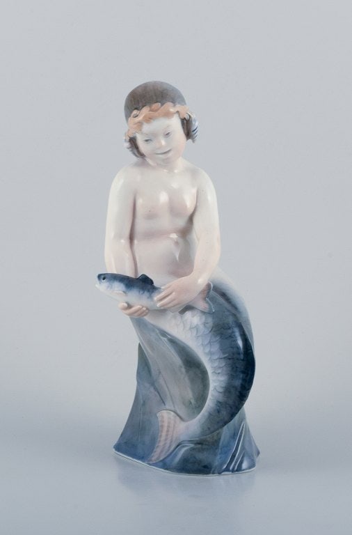 Royal Copenhagen, rare porcelain figurine of a mermaid holding fish in her hands. - 2