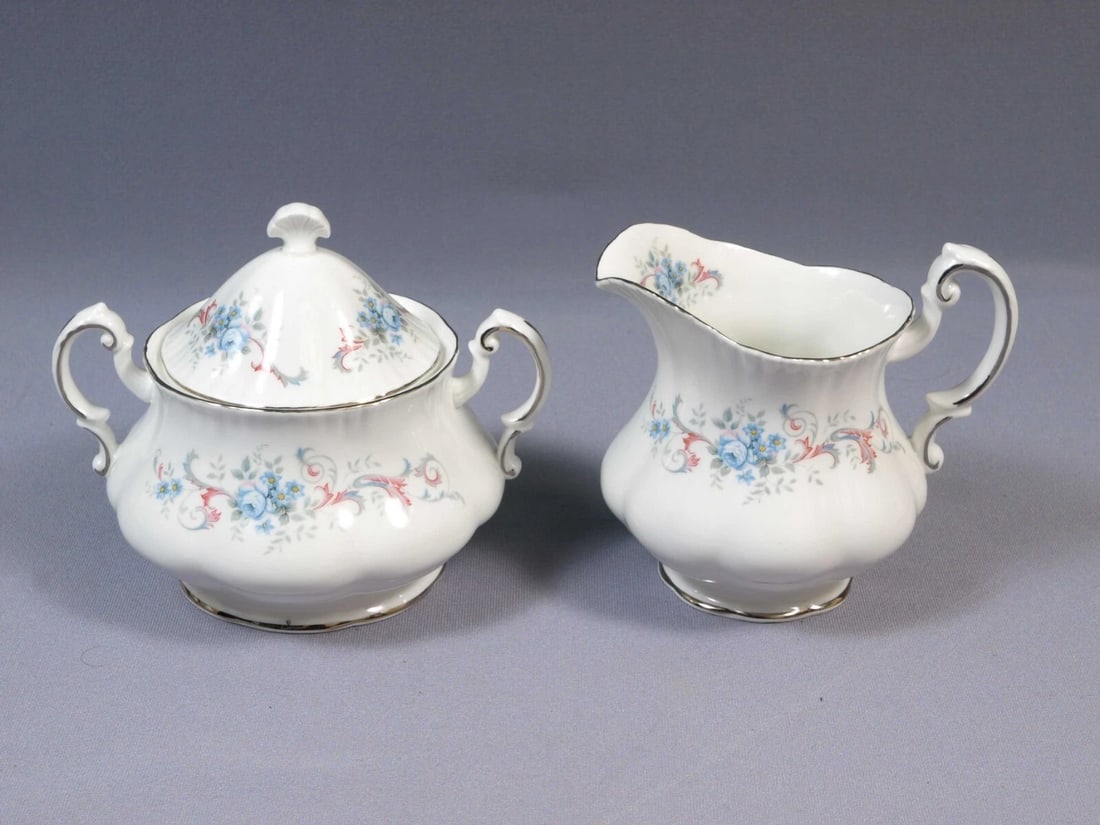 Paragon ROMANCE Creamer Milk Jug Cover Sugar Bowl Silver Platinum Rim England: This is one exceptional Covered Sugar Bowl and Creamer/Milk Jug made by Royal Paragon, England. The set is in the Romance pattern. It is properly marked with Paragon Backstamp. The set includes: 1 (on