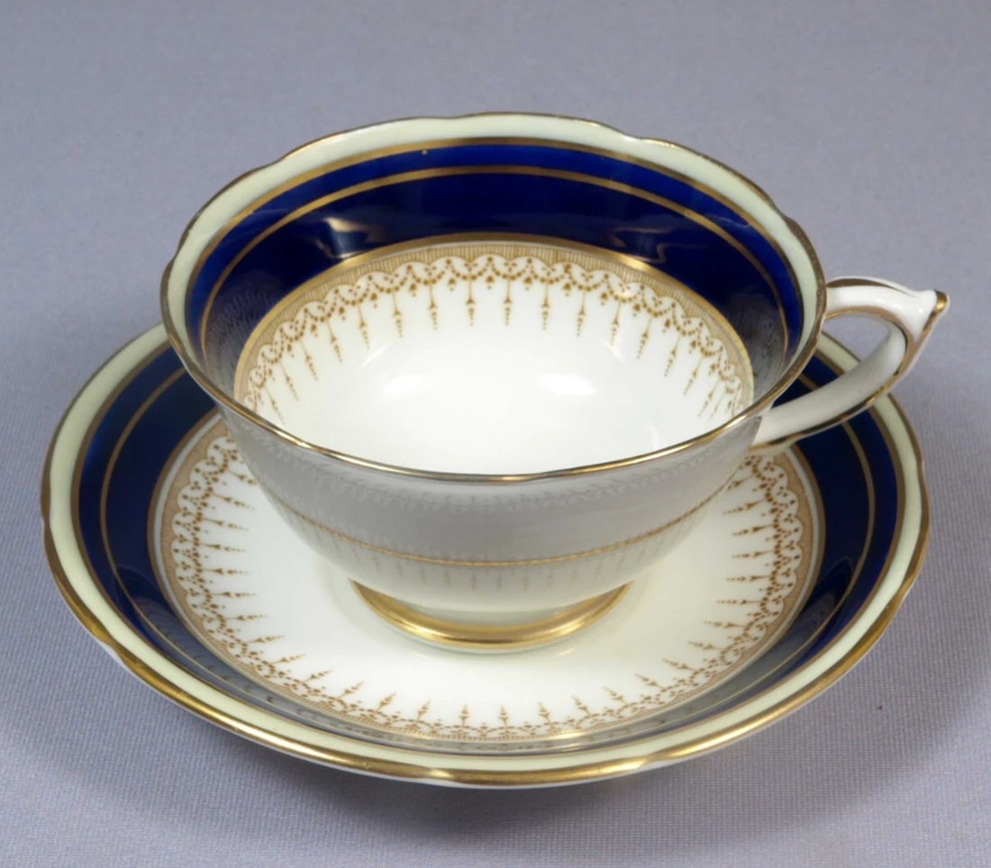 Paragon ATHENE Cobalt Blue Coffee Tea Cup England Made for Simpsons Toronto: This is one exceptional Coffee/Tea cup and saucer set was made by Paragon, England. The set is in Athene pattern. It is a hard to find pattern. The set is expressly made for Simpsons, Toronto, Canada.