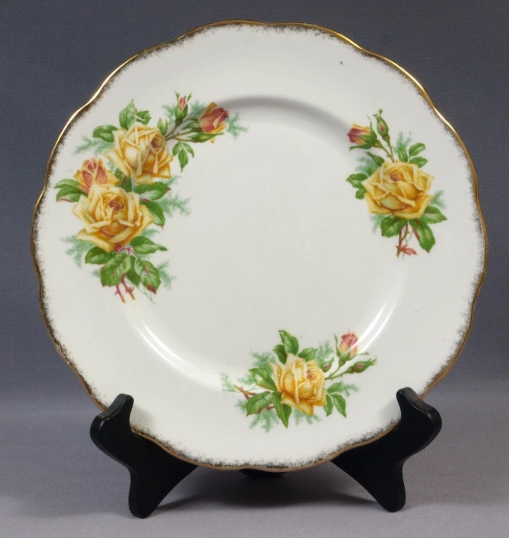 Royal Albert Yellow Tea Rose Luncheon plate England: THE PRICE IS FOR ONE PLATE ONLY!!! This is a stunning Bone China Luncheon/Salad Plate, from the famous Yellow Tea rose Collection. The plate is made by Royal Albert in England. It is properly marked w