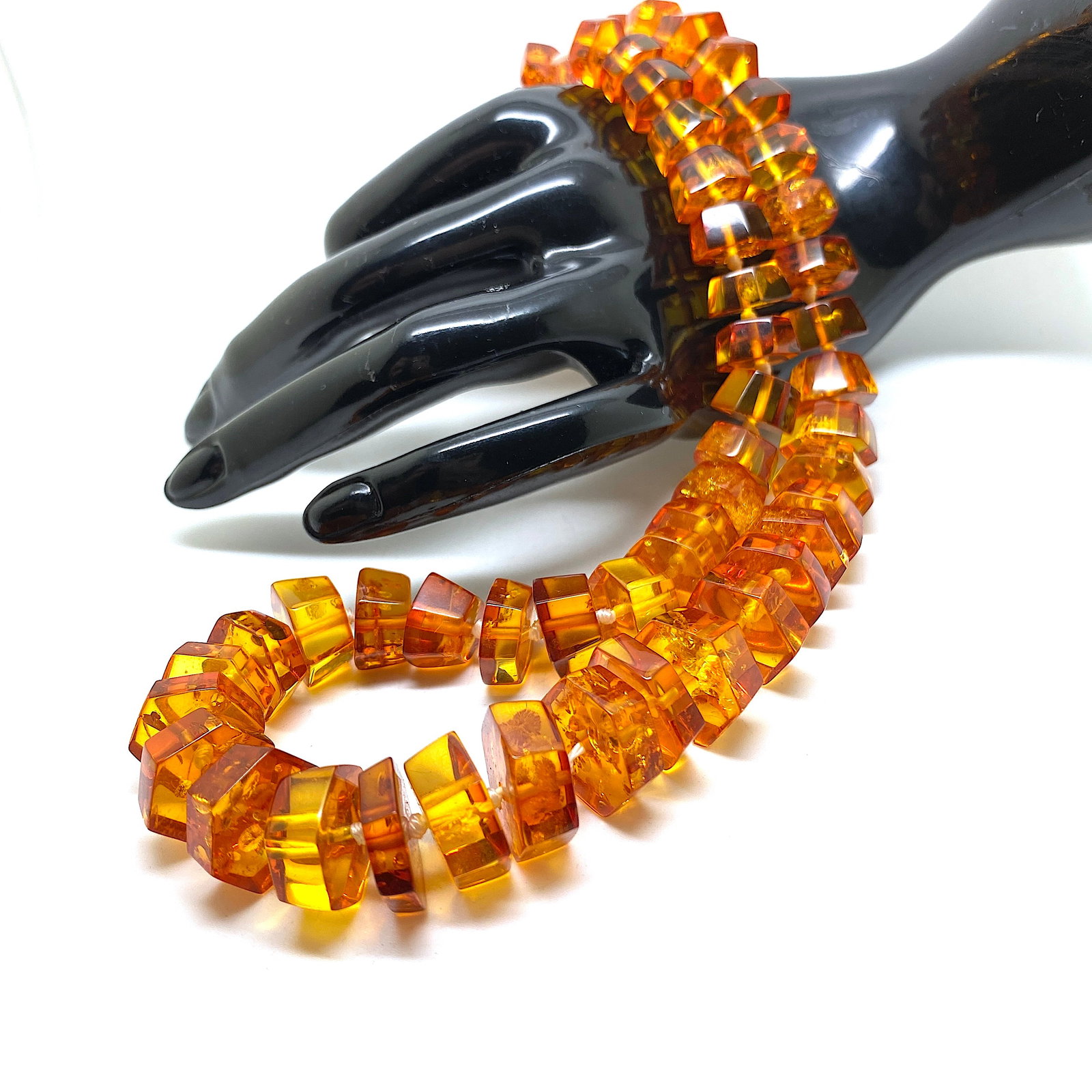 Staggering Vintage Amber Necklace made from Hand Carved Amber beads: Title: Staggering Vintage Amber Necklace made from Hand Carved Amber beads Metal: None Gemstone: Amber Weight: 43.4 g Size: Size: 520.0 x 12.0 x 12.0 mm Size: 20.472 x 0.472 x 0.472 inches Bead size: