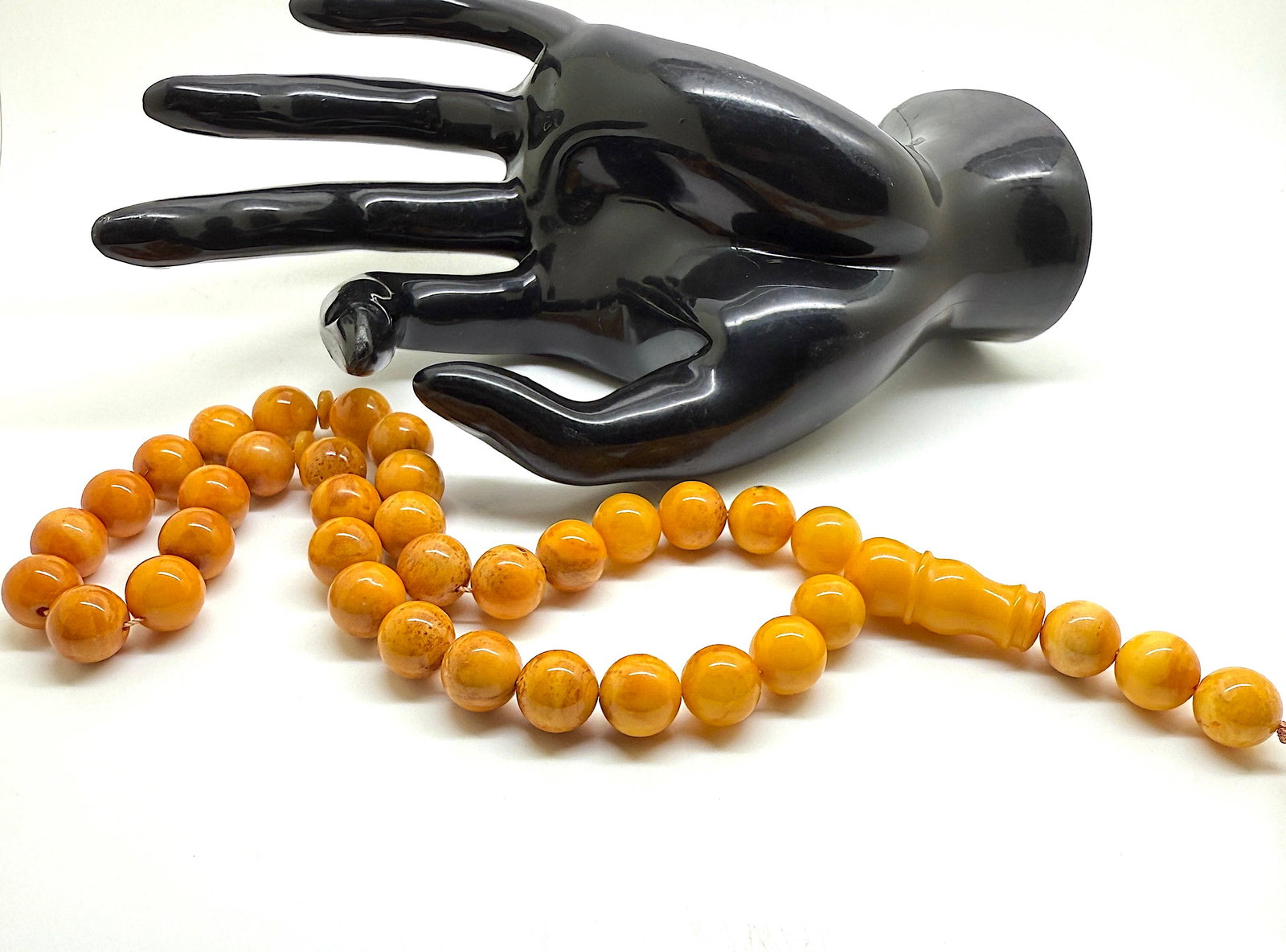 Outstanding Amber Tesbih made from Round Amber beads: Title: Outstanding Amber Tesbih made from Round Amber beads Metal: None Gemstone: Amber Weight: 28.4 g Size: Bead size: 11.0 mm Bead size: 0.433 inches Made of: (Reconstituted Amber or Whole Stone): R