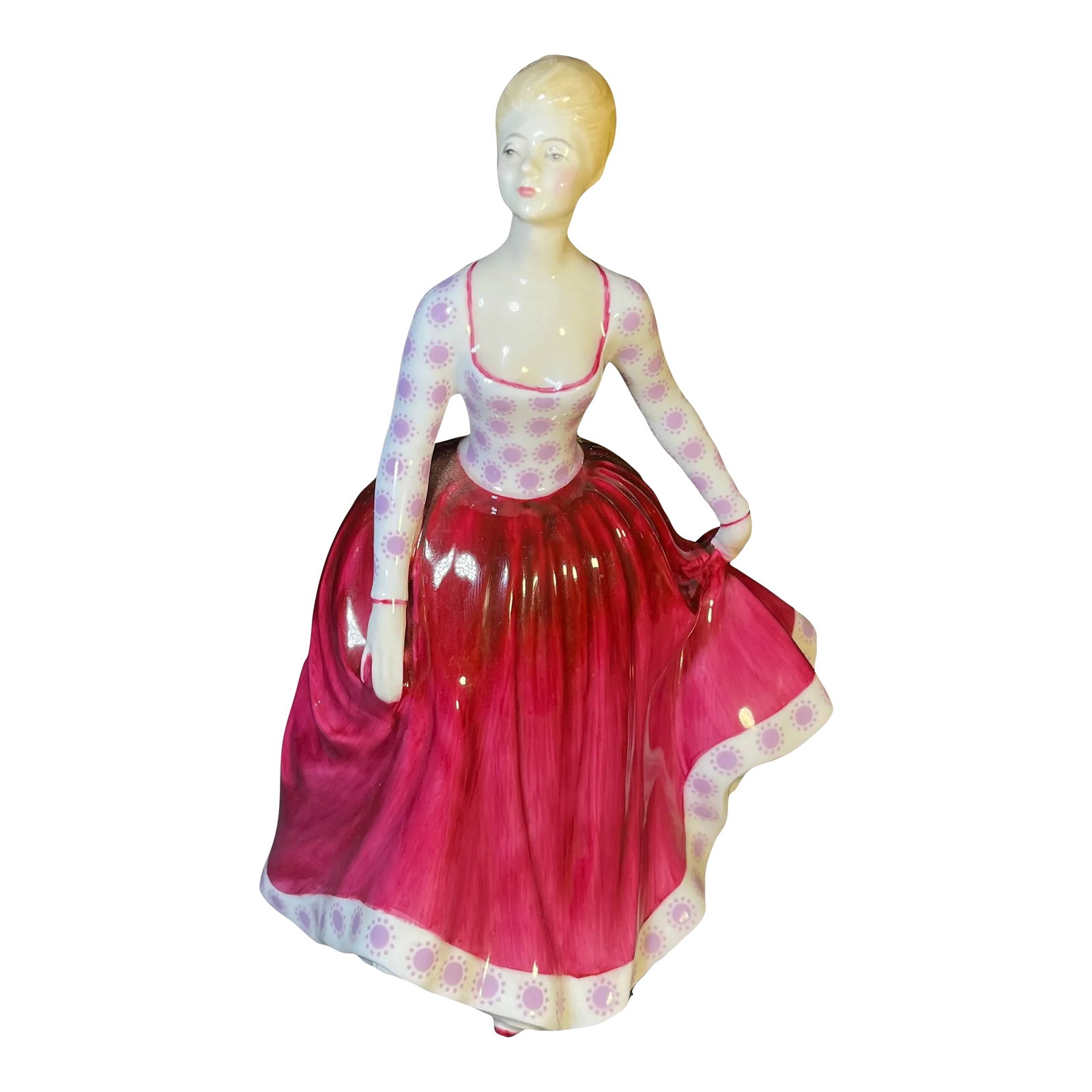 1970s Royal Doulton Porcelain Figurine, Fiona Hn2694: A figure of a young lady in a magenta skirt and pink floral top. Royal Doulton backstamp. Condition: Alterations: Original Condition Unaltered Imperfections: Some Imperfections Condition Notes: Age re