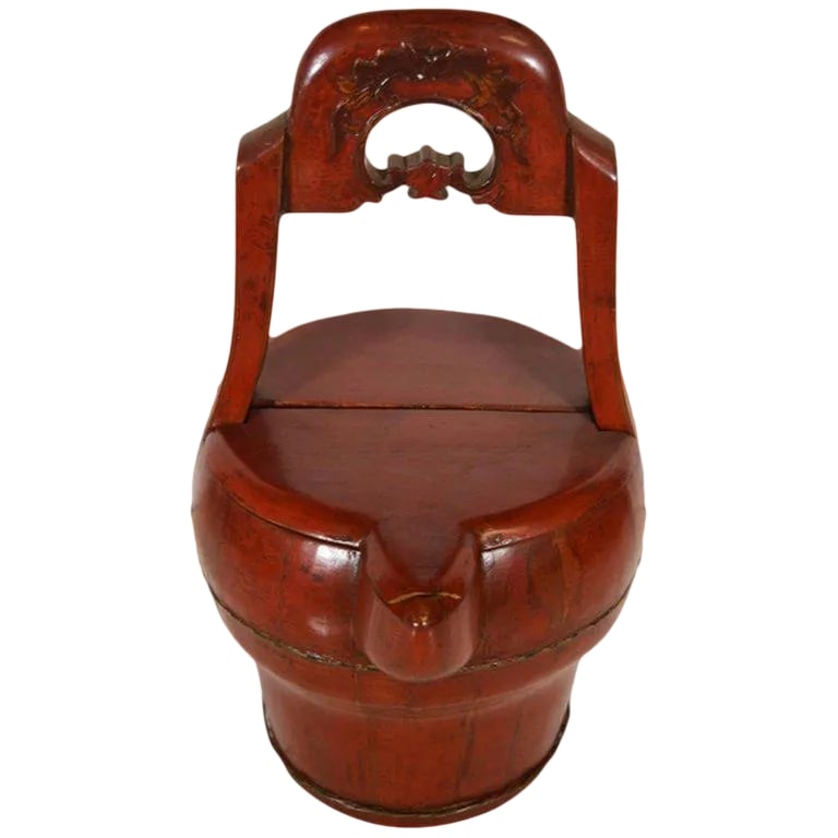 Antique Hand-Carved Red Lacquered Basket With Spout From 19th Century, China: A 19th century Chinese basket with spout, hand-carved and lacquered in red. This circular basket displays a globular belly mounted on a cylindrical base. The flat top opens thanks to a hinged