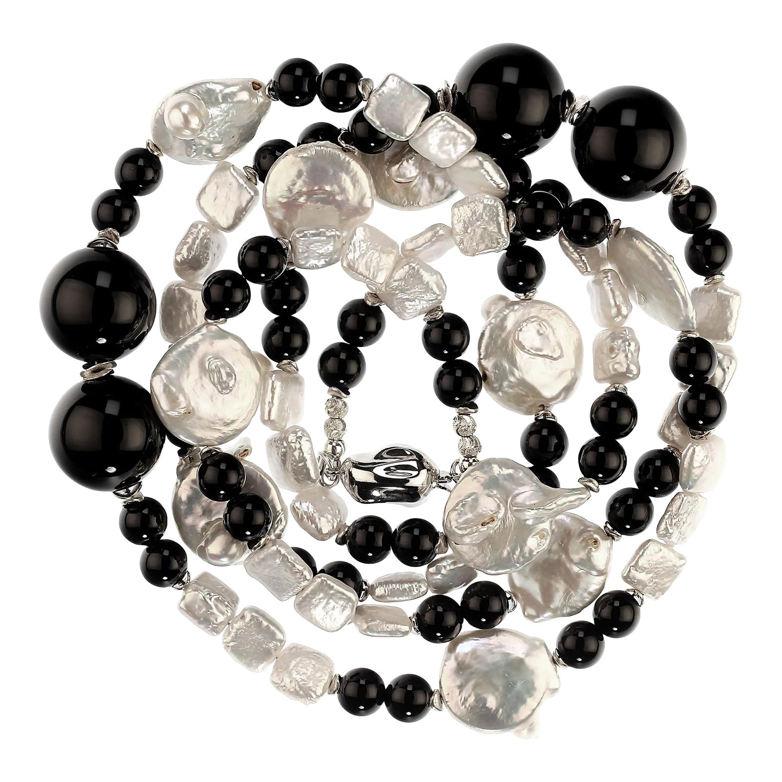 Black and White Pearl and Onyx Necklace: This is part of Chairish's Fine Jewelry assortment. This is a lovely, long white Coin Pearl and Black Onyx necklace that is a pleasure to wear. You can wear it long or double it. It features white iri