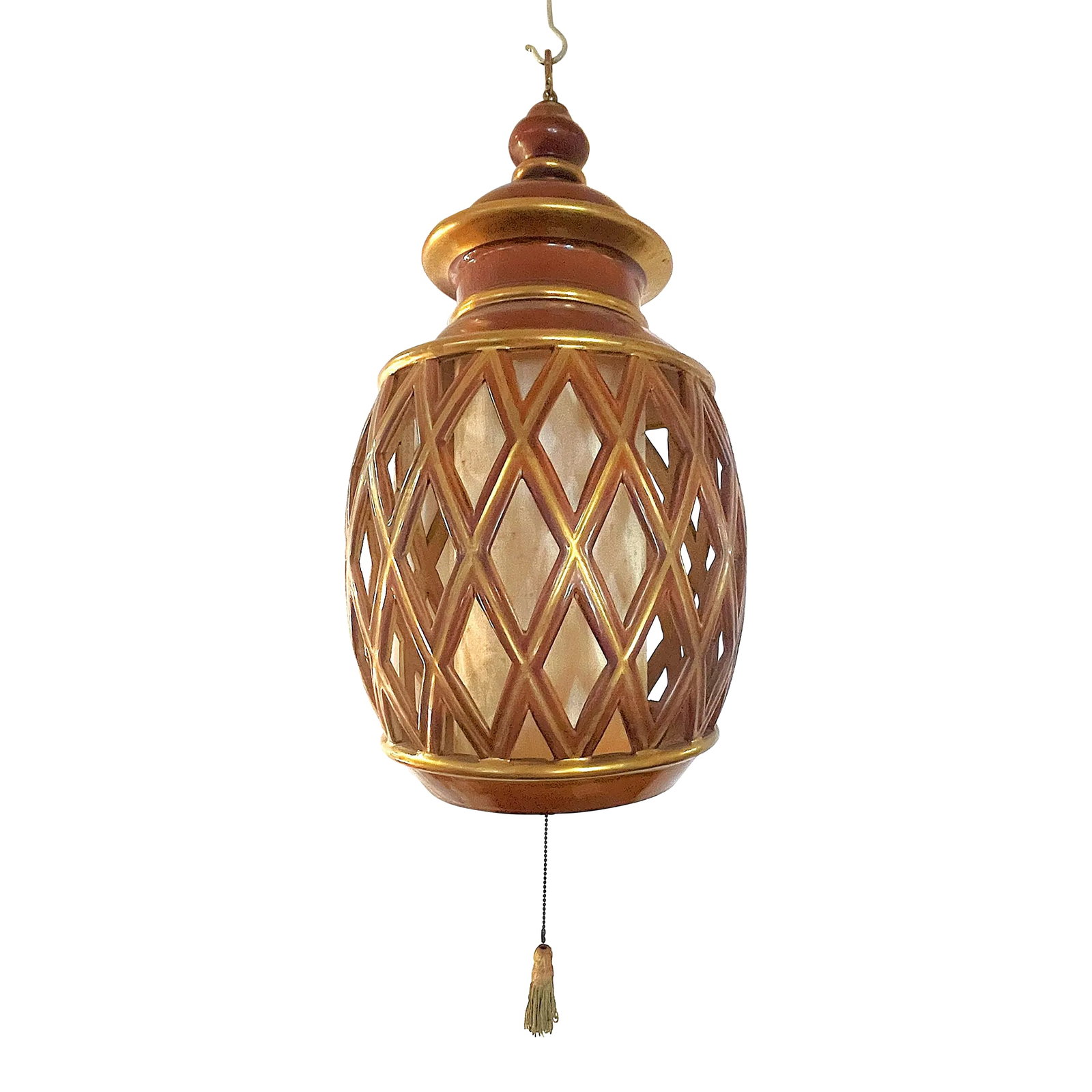 Mid Century Ceramic Electrified Lantern With Silk Inner Shade and Tassel Pull Cord: Just fabulous mid century ceramic lantern! The piece is made of ceramic glazed in gold and cinnamon colors. It has an inner silk shade that gives off an awesome warm red glow when lighted, and comes