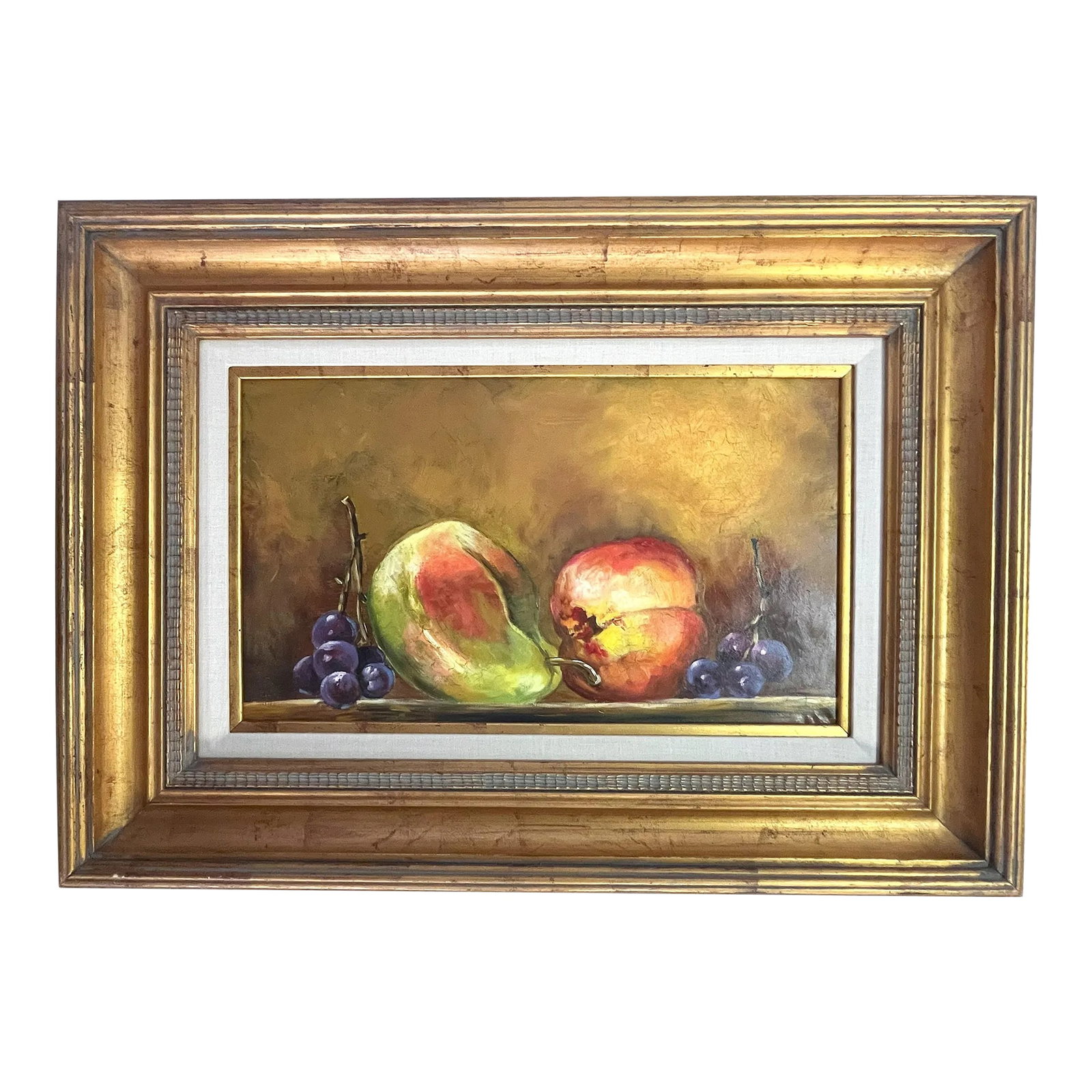 Original Signed and Framed Still Life Oil Painting on Canvas: Timeless signed and framed oil painting on canvas. This still life artwork depicts fruit on a table with an ochre background. It is signed illegibly in the bottom right corner. It is presented in a th