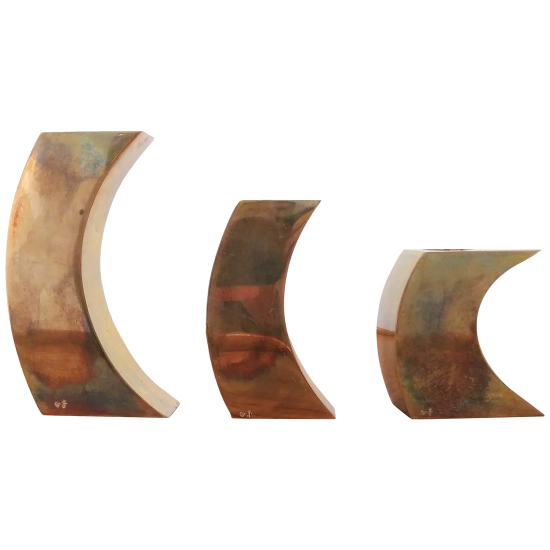 Signed Suite of Three Solid Patinated Bronze Candle Holders, France, 1970s: Suite of three (3) French candleholders, solid patinated bronze. 1970s. Signed by Monique Gerber. Tallest candleholders is 5" high 2.4" deep and 1.5" thick Smallest: 3" high, 2.5"deep and 1.5" thick.