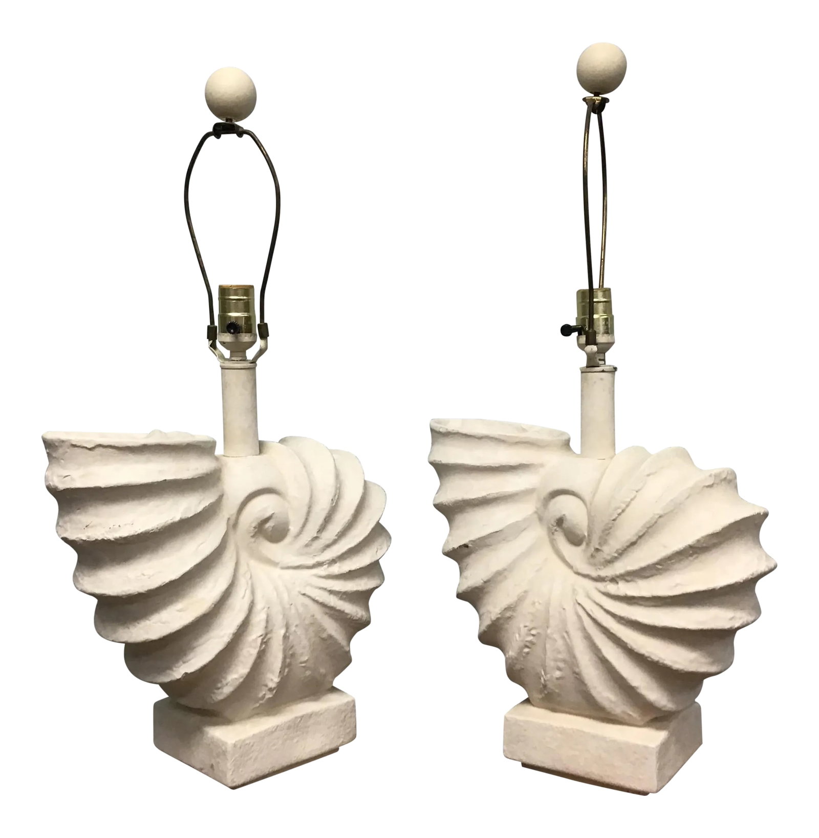 White Plaster Nautilus or Ammonite Lamps - a Pair: Pair of rare white plaster nautilus or ammonite table lamps. These are a rare to find in this style. They are vintage lamps and are wired and ready for use. Condition: Alterations: Original Condition
