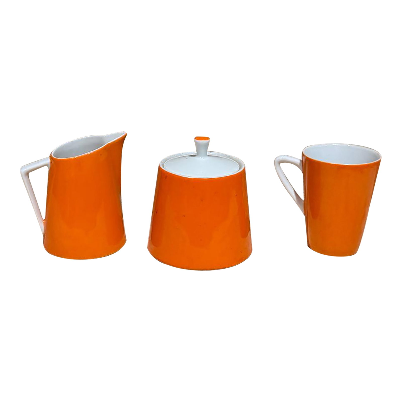 1960s Modernist Orange Sugar Creamer Set & Coffee Mug: For your consideration a mid-century modern orange sugar creamer set. Coffee mug. Unmarked. Dimensions: Sugar 4 H x 3.38Â Creamer 3.63 H x 3.25 x 2.5 diameter Cup 3.18 H x 3.13 D x 2.25 dia
