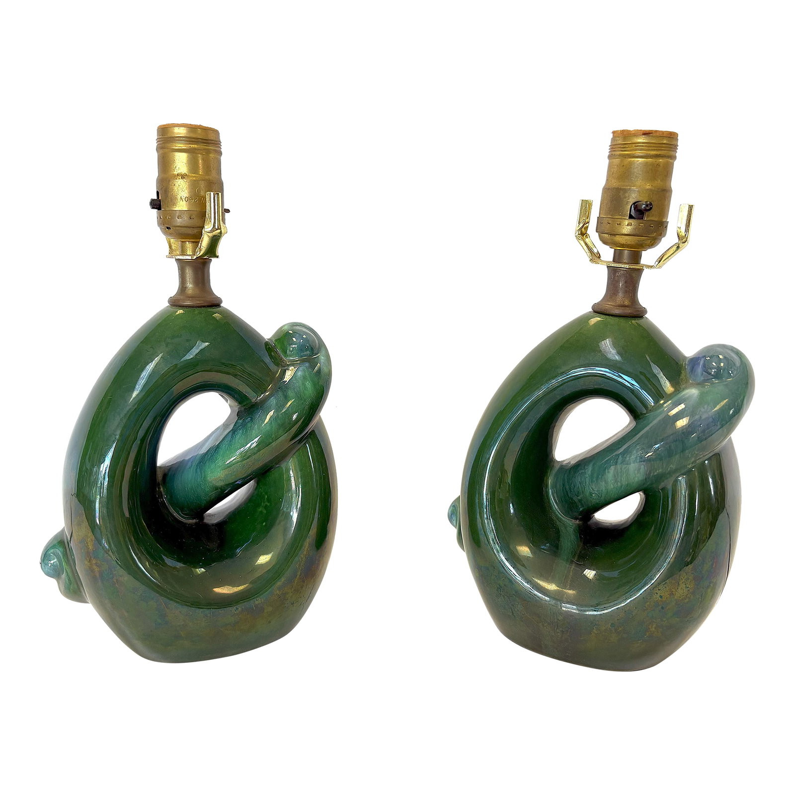 Mid Century Modern Royal Haeger Style Green-Blue Drip Glaze Ceramic Lamps- A Pair: Groovy pair of Royal Haeger style lamps from the mid 20th century. They are made of ceramic with an organic mobius-like shape and a gorgeous green-blue drippy glaze. They are not marked. Lampshades