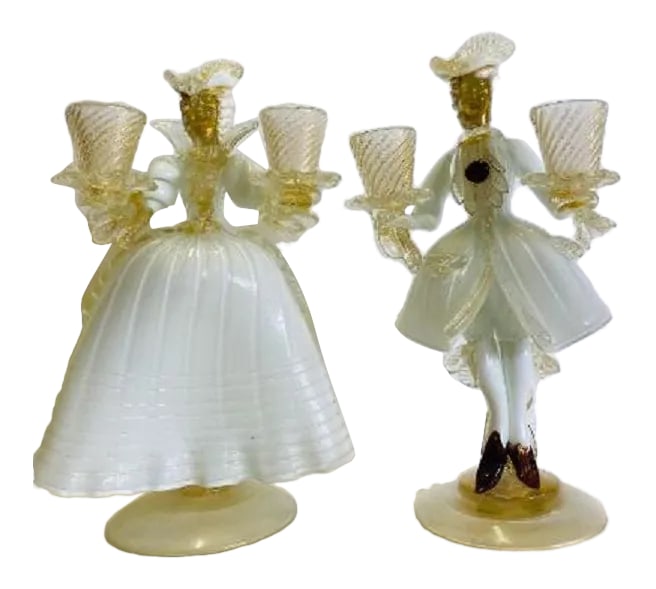 Vintage Murano Glass Figurines-Pair: Pair of vintage Murano glass figure double candle holders of a man and woman in clear, gold, white and maroon glass in perfect condition. Condition: Alterations: Original Condition Unaltered Imperfect