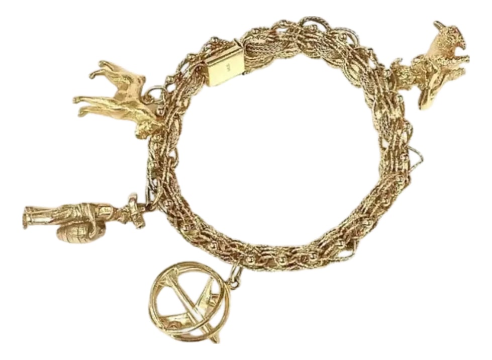 Ladies Heavy 14k Gold Charm Bracelet: This heavy vintage 1960's ladies 14K gold charm bracelet is embellished with four (4) various unique charms. The double link 7" long gold bracelet has a snap in lock with a safety hook & a support